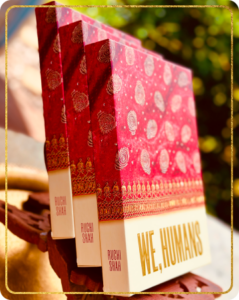 A stack of We, Humans books