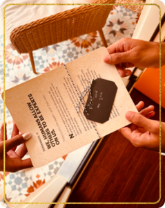 Humans exchanging a page from We, Humans book as a gift